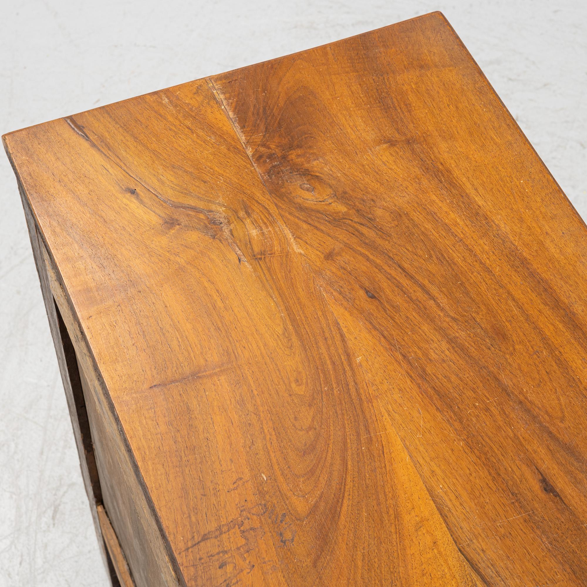 A Walnut veneered chest of drawers, late 19th Century.