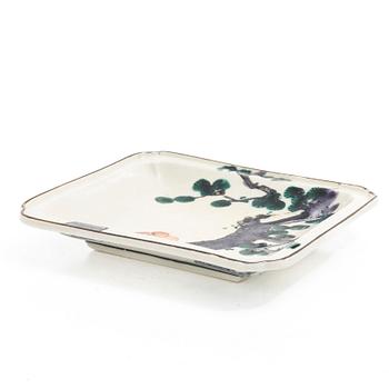 A small Japanese gilt copper box with cover and a porcelain dish, 19th century.