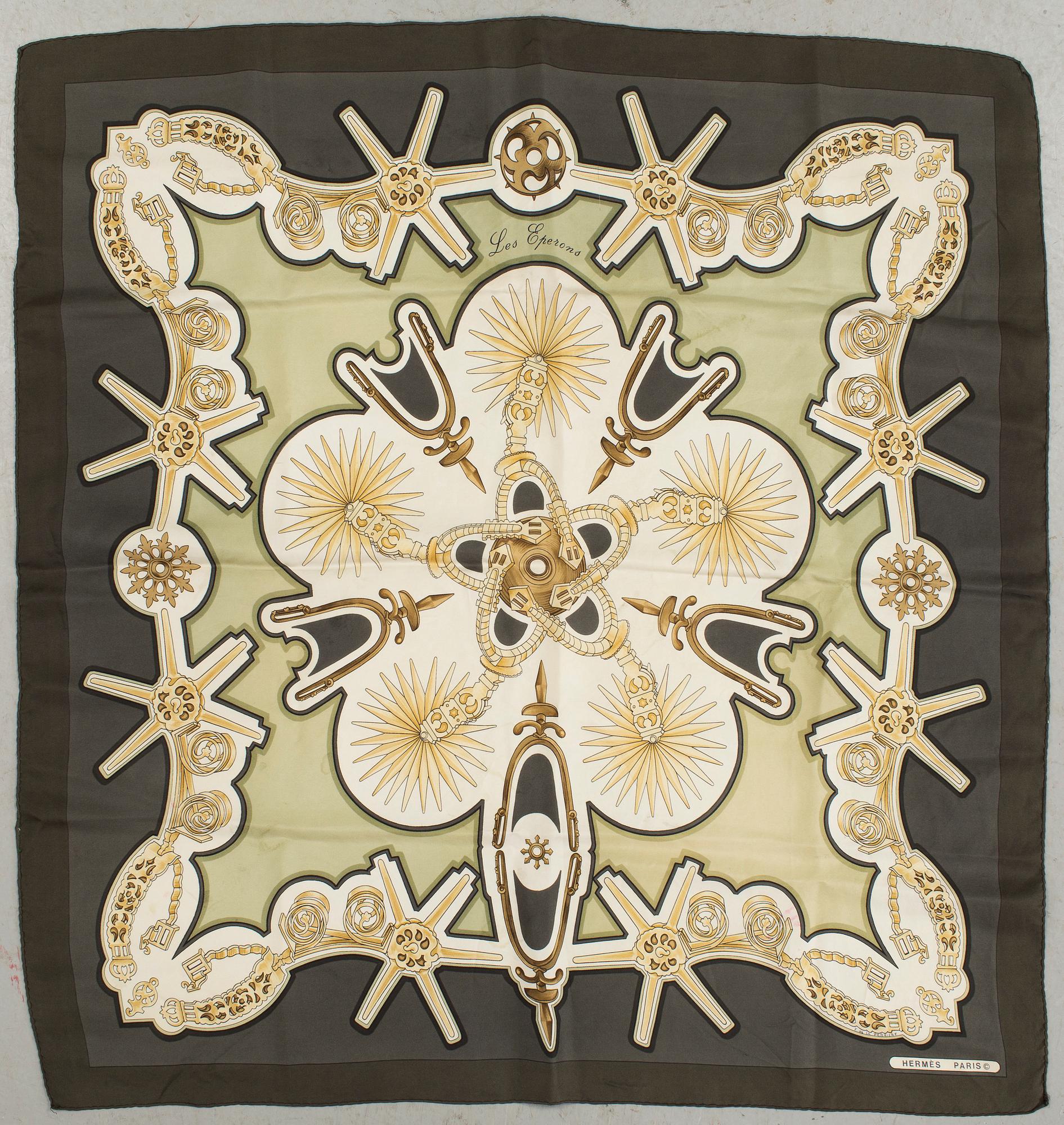 A "Les Eperons" silk scarf by Hermès.
