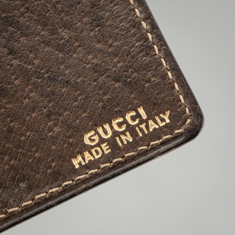 PLÅNBOK SAMT GLASÖGONFODRAL, Gucci.