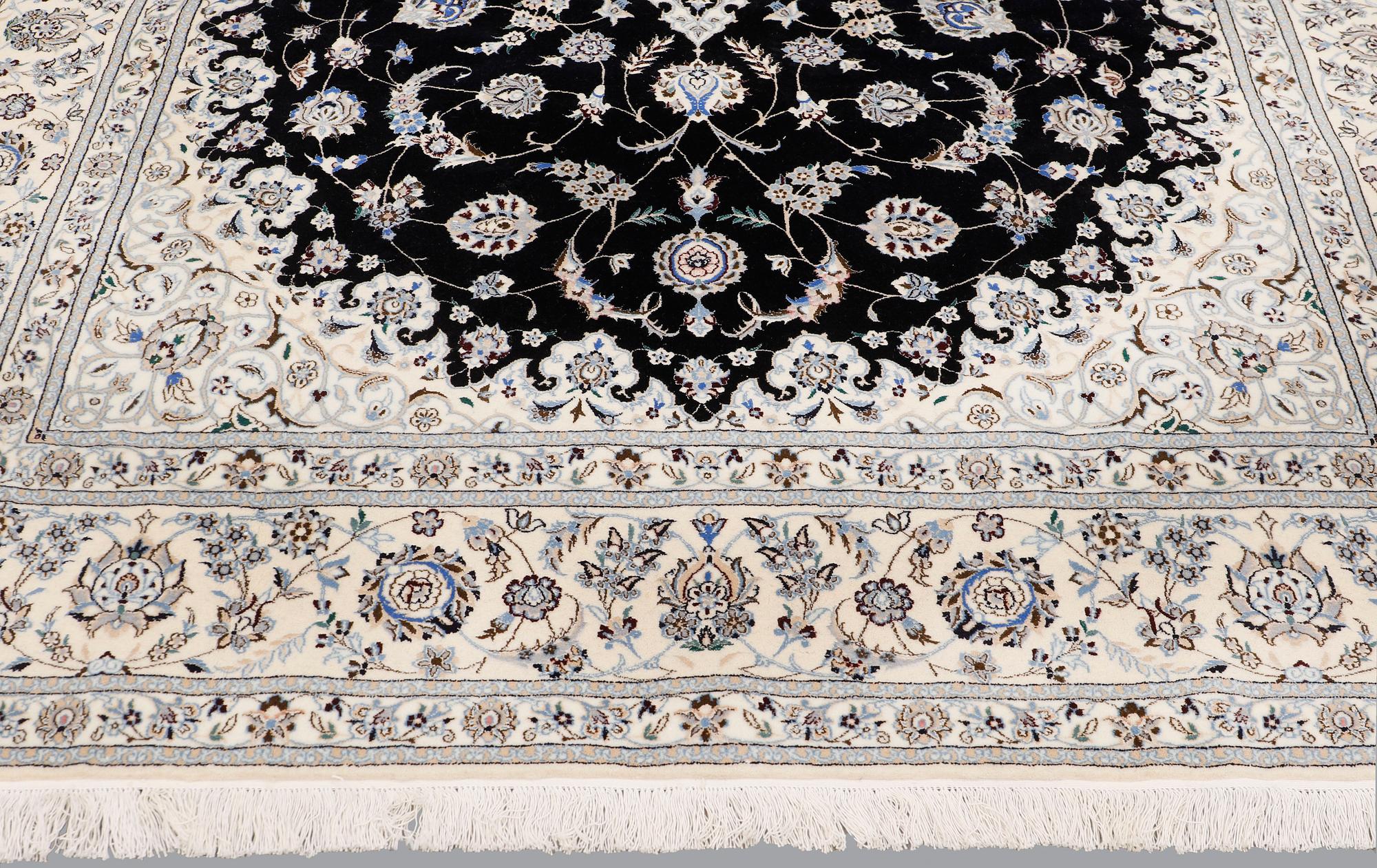 A Nain part silk carpet, 310 x 204 cm.