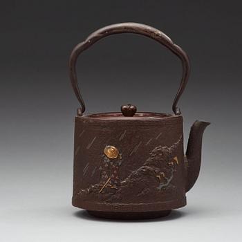 A Japanese iron and bronze tea pot with cover, Meiji period 1868-1912).