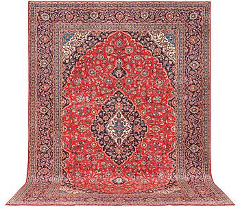 A Kashan carpet, a. 430 x 302 cm.