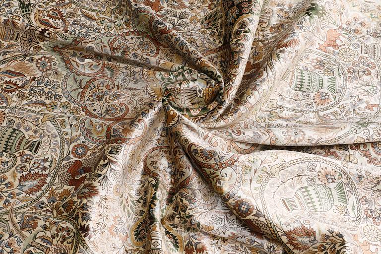 A figural Oriental silk carpet, approx. 273 x 180 cm.