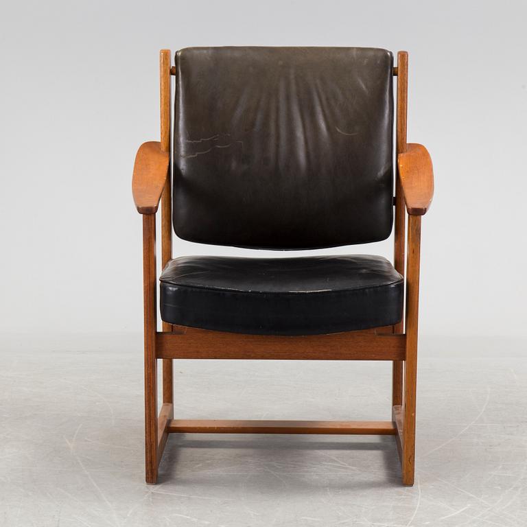 A treak and leather armchair by Sven Kai-Larsen, Sadelmakarmästarna, NK verkstäder.