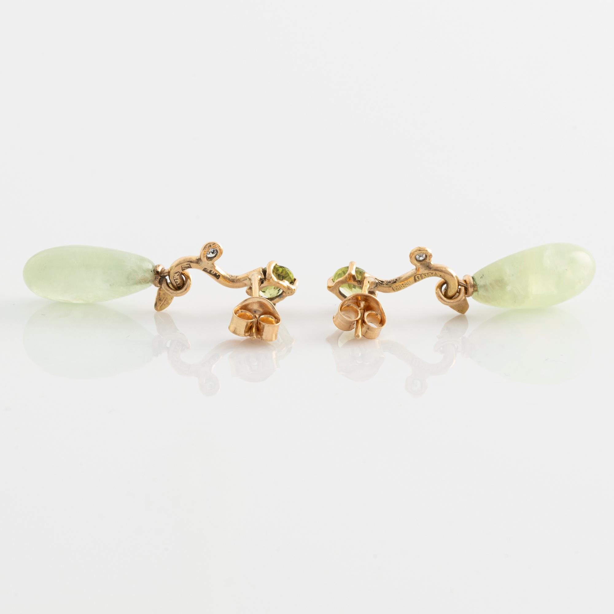 Earrings with pear-shaped prehnite, peridot, and brilliant-cut diamonds.