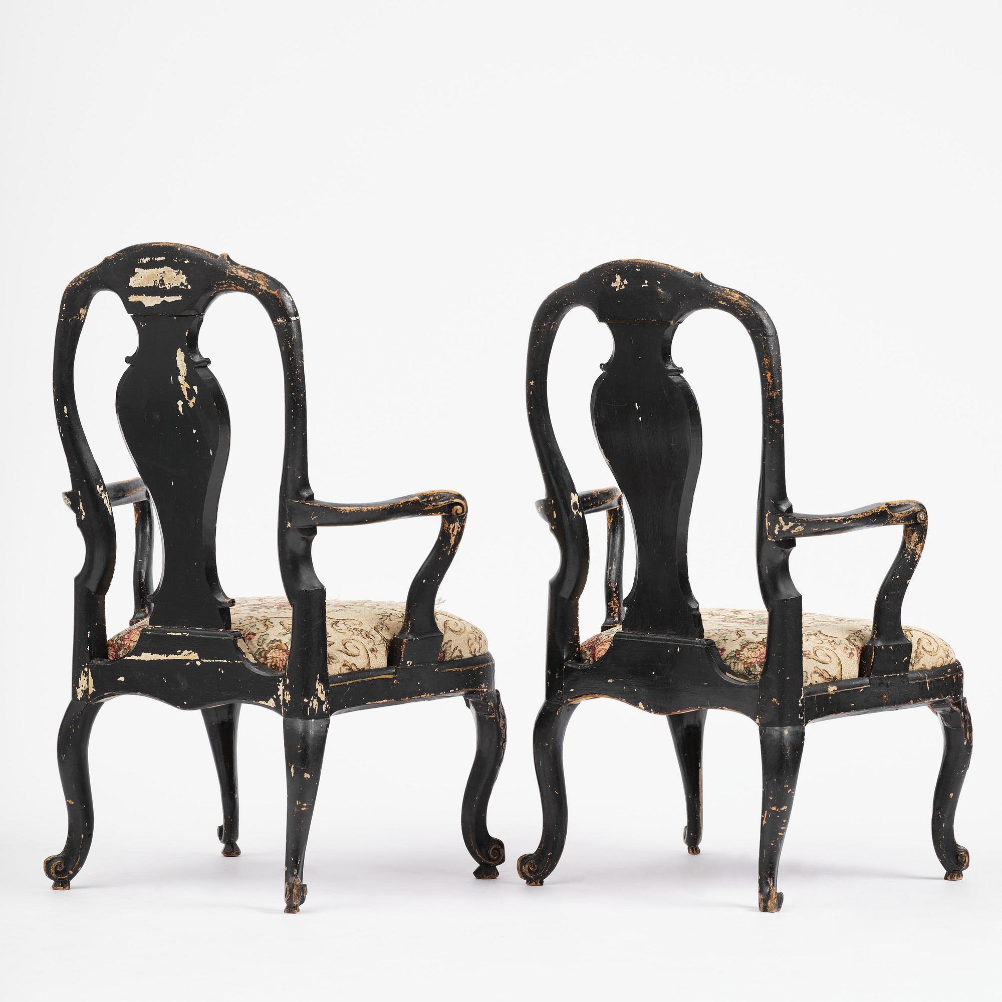 A pair of rococo armchairs in the manner of C. M. Sandberg, later part 18th century.