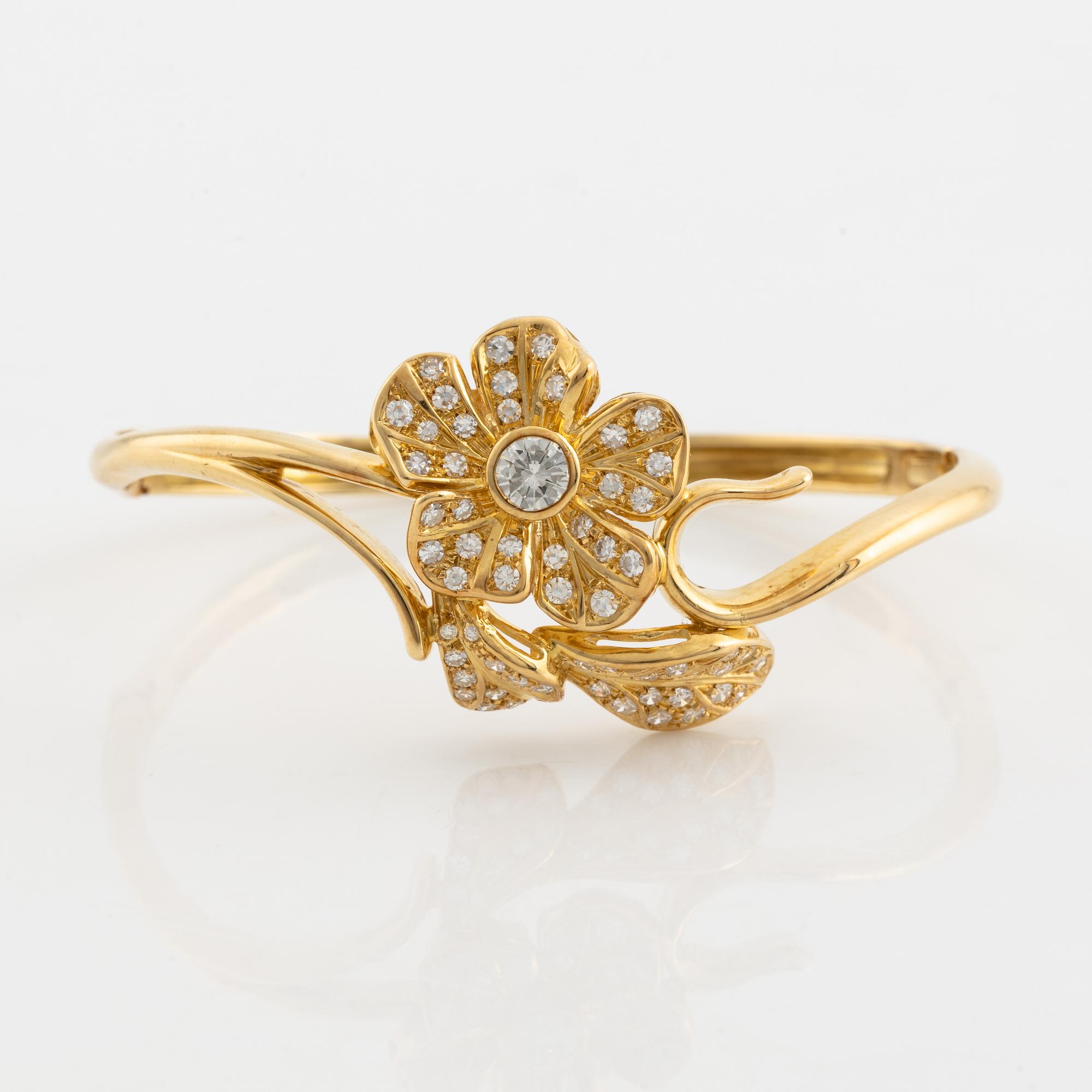 18K gold and brilliant- and eight cut diamond flower bangle.