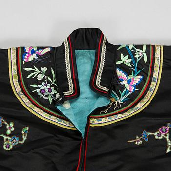 A Chinese embroidered silk robe and a buzi and five other silk embroideries, early 20th century.