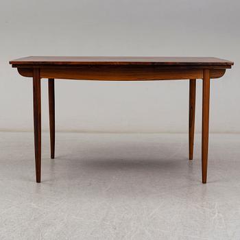 A 1950's/60's rosewood dinner table with four chairs, Denmark.