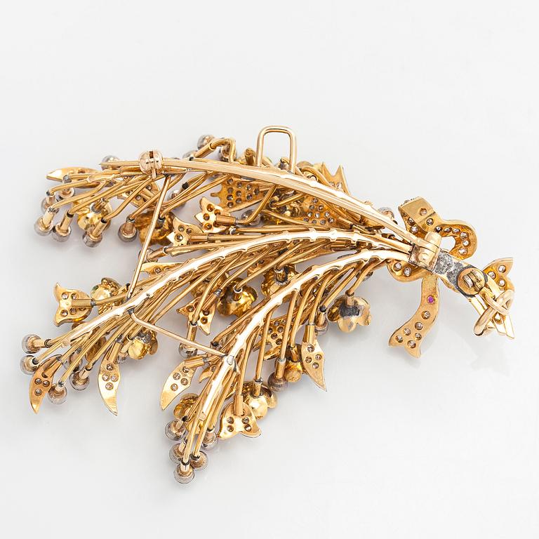 A 17K gold brooch/pendant with rose-cut diamonds, cabochon-cut rubies and enamel.