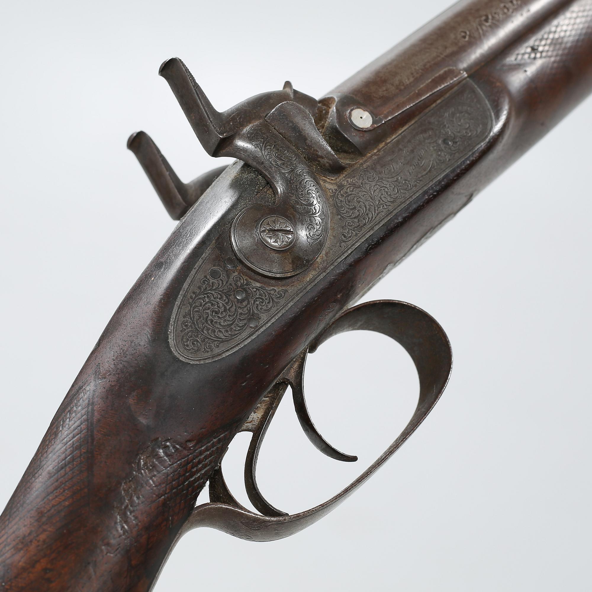 A percussion rifle by Charles William Lanchester in London, around the mid 19th century.