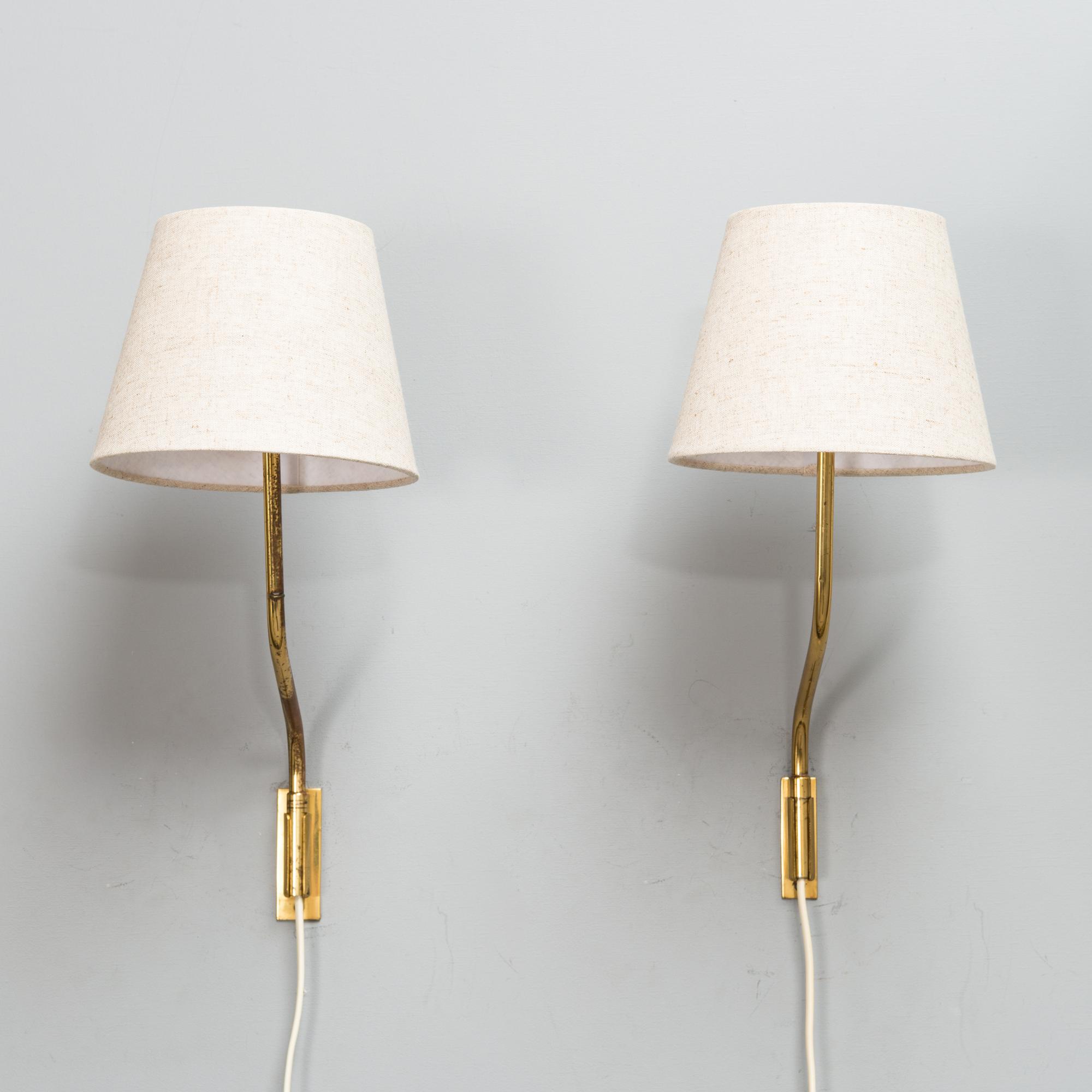 Lisa Johansson-Pape, Two mid-20th century '3053' wall lights for Stockmann Orno.