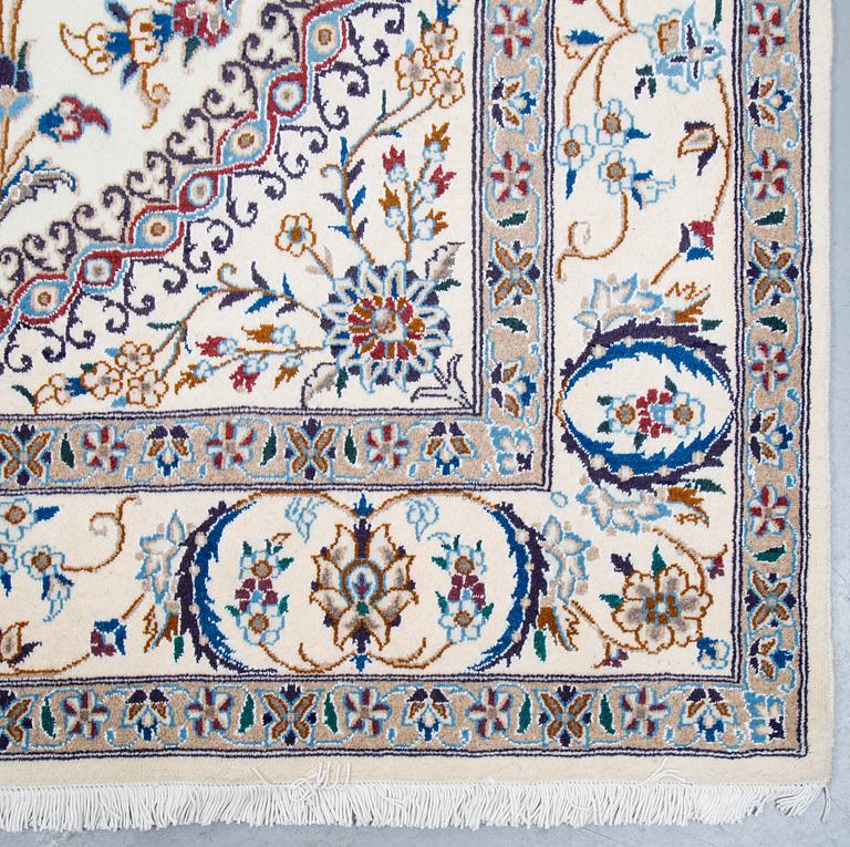 A carpet, Nain, part silk, ca 296 x 192 cm.