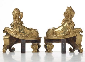 A pair of Louis XV fire dogs, France, mid 18th century, the design of the sphinxes attributed Nicolas Coustou 1658-1733.