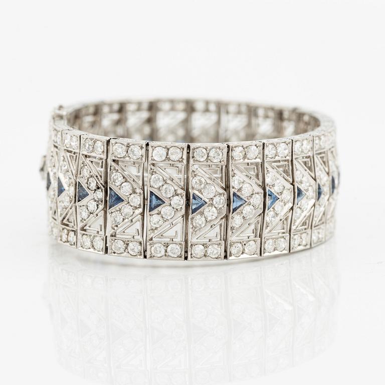 A platinum bracelet with old-cut diamonds and sapphires, likely Bucherer.