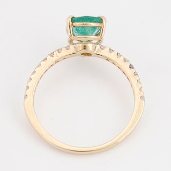 Pear shaped emerald and brilliant-cut diamond ring.