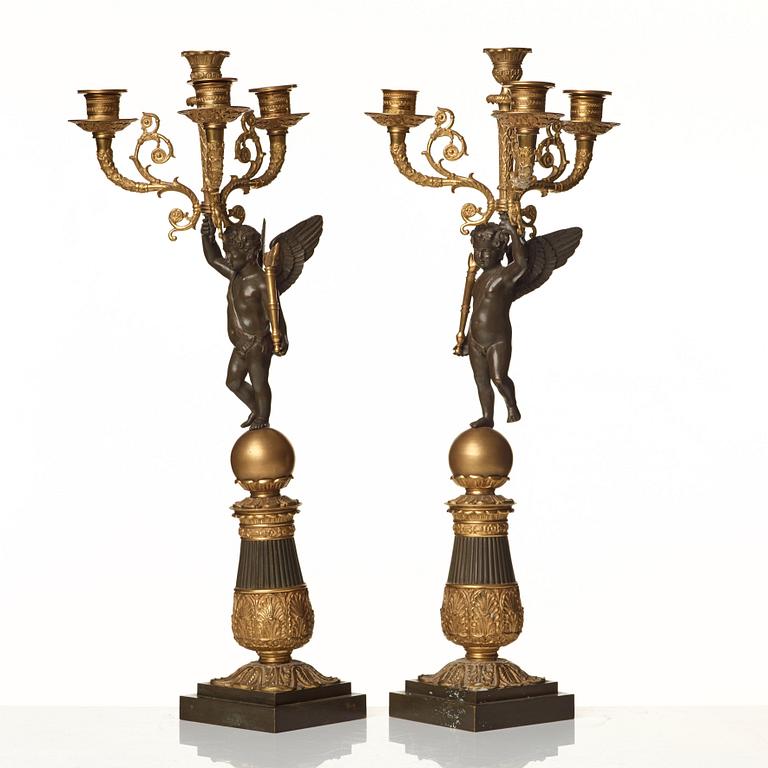 A pair of French Empire early 19th century four-light candelabra.