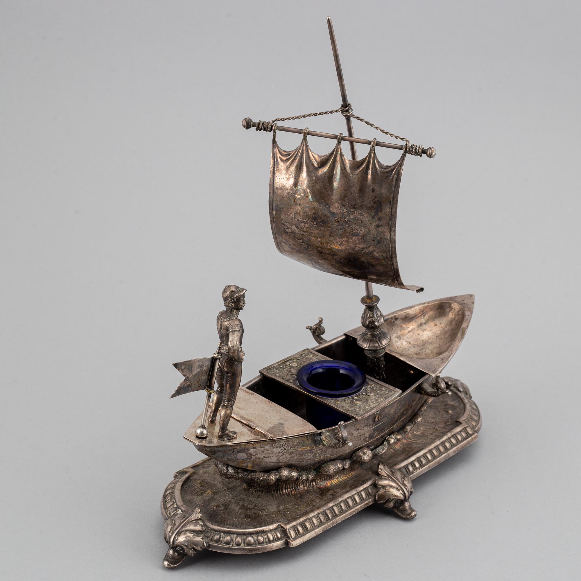 A silver plated inkwell, circa 1900.