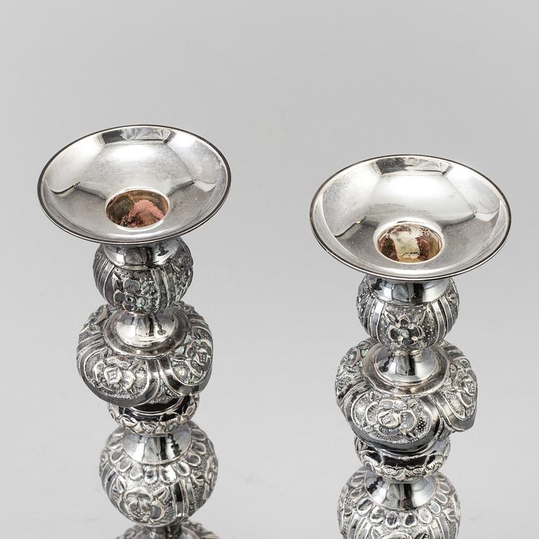 A pair of silver Sabbath candlesticks, Maker M. Sztern, Warsaw, Poland. Assayer Josef Sosnkowski, 1864. Weight 833 g.