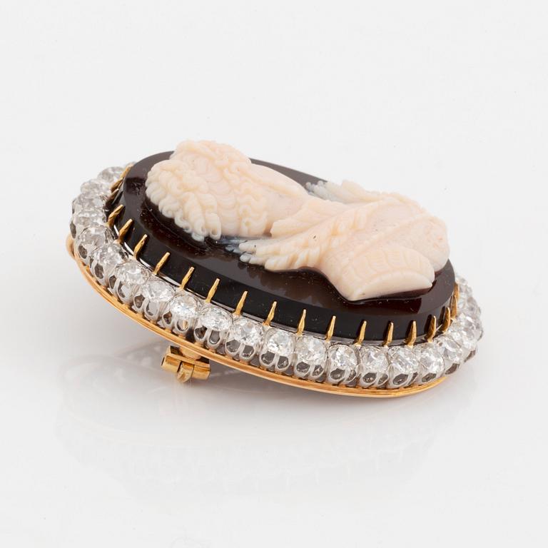 A hardstone cameo brooch with a frame of old cut-dimonds.