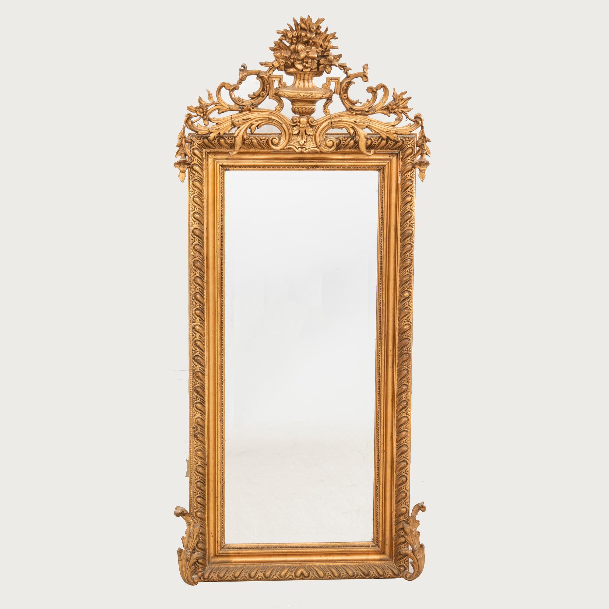 A Neo Rococo bronzed mirror around 1900.