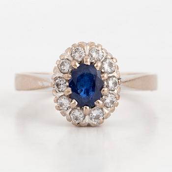 Sapphire and brilliant-cut diamond cluster ring.