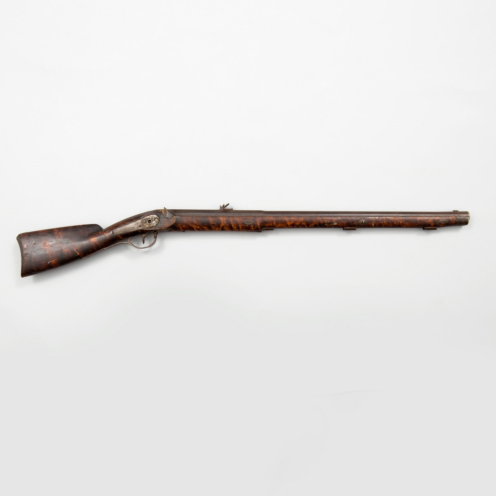 A mid 19th century percussion rifle.