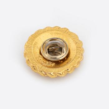 Céline, a set of four gold tone brooches.