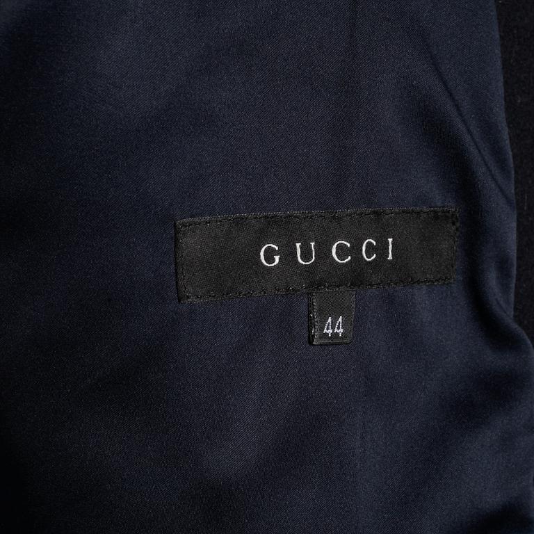 GUCCI, a black wool coat.