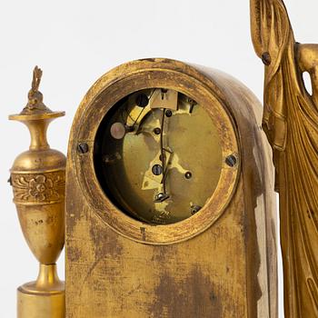 An ormolu Empire mantel clock, first part of the 19th century.