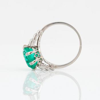 A cushion-shape mixed cut Colombian emerald, 4.56 cts, and baguette-cut diamond ring.