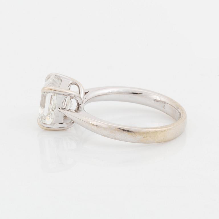 An 18K white gold ring set with an Asscher-cut diamond.