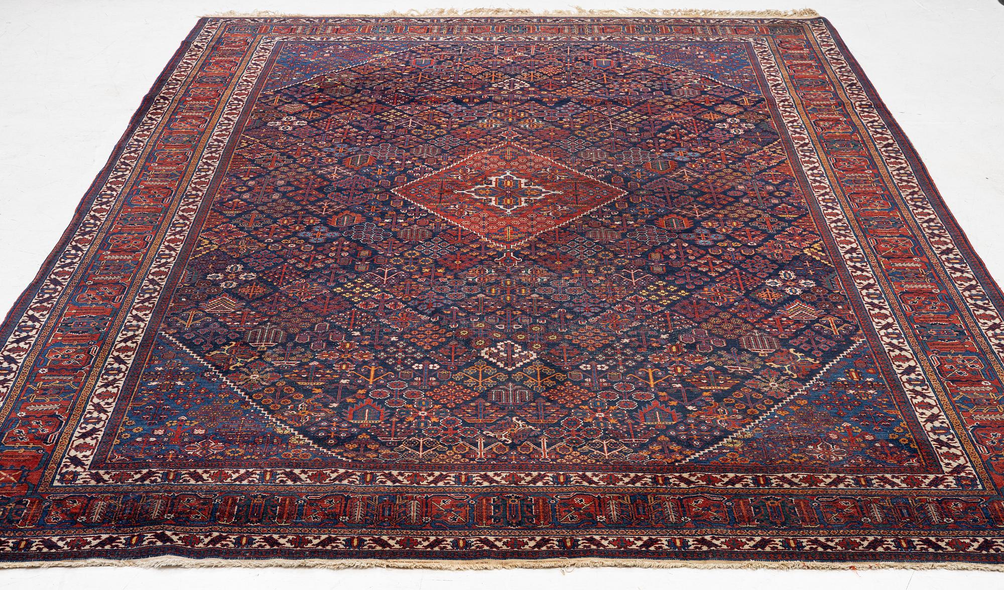 An oriental carpet, c. 360 x 270 cm.