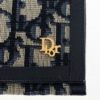 Christian Dior, a wallet.