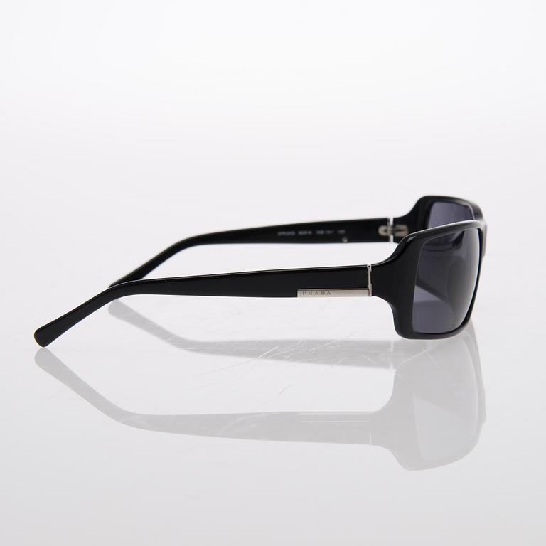 Two Pairs of Sunglasses, Prada and Chanel.