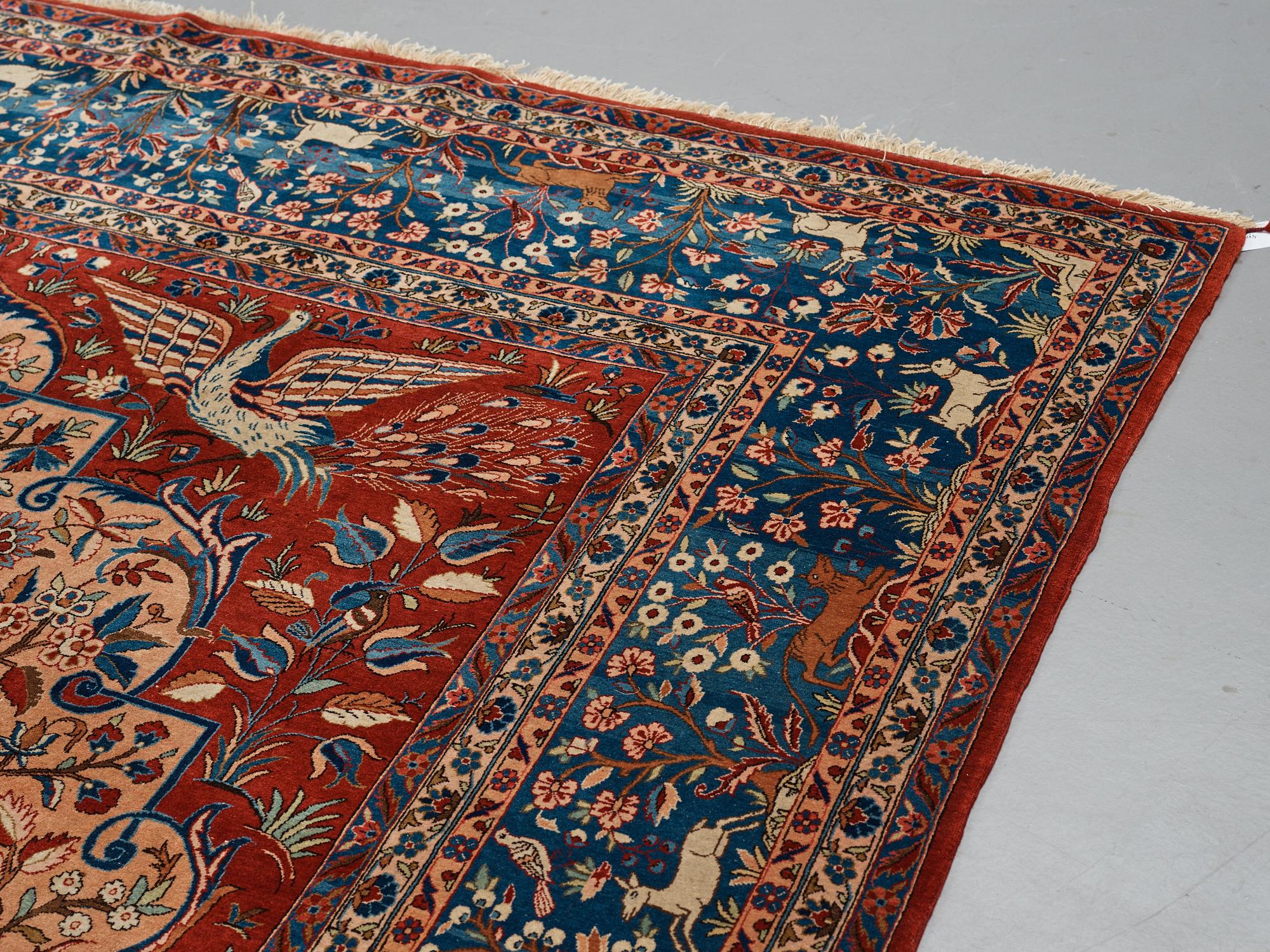 A carpet, a semi-antique Kashan, a so called Dabir, ca 383,5-387,5 x 269,5-275 cm.