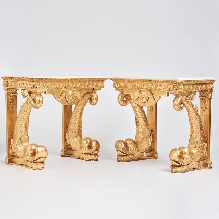 A pair of Swedish Empire carved and giltwood console tables, first half of the 19th century.