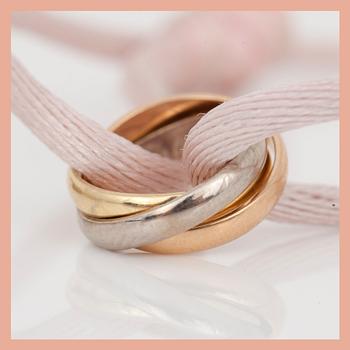 ARMBAND, 2st, tri-colour 18K guld samt tråd, Cartier, signerad och numrerad.