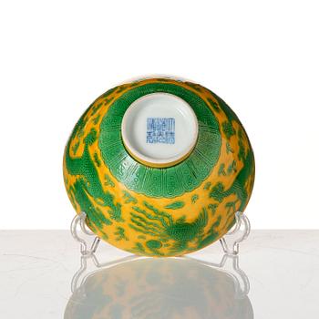 A yellow-ground green-enamelled 'dragon' and phoenix bowl, underglaze blue Daoguang seal mark and of the period.