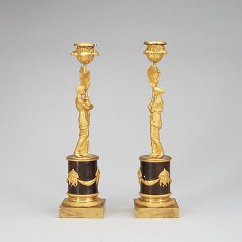 A pair of Louis XVI late 18th Century candlesticks.