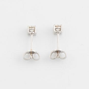 Brilliant cut diamond stud earrings.