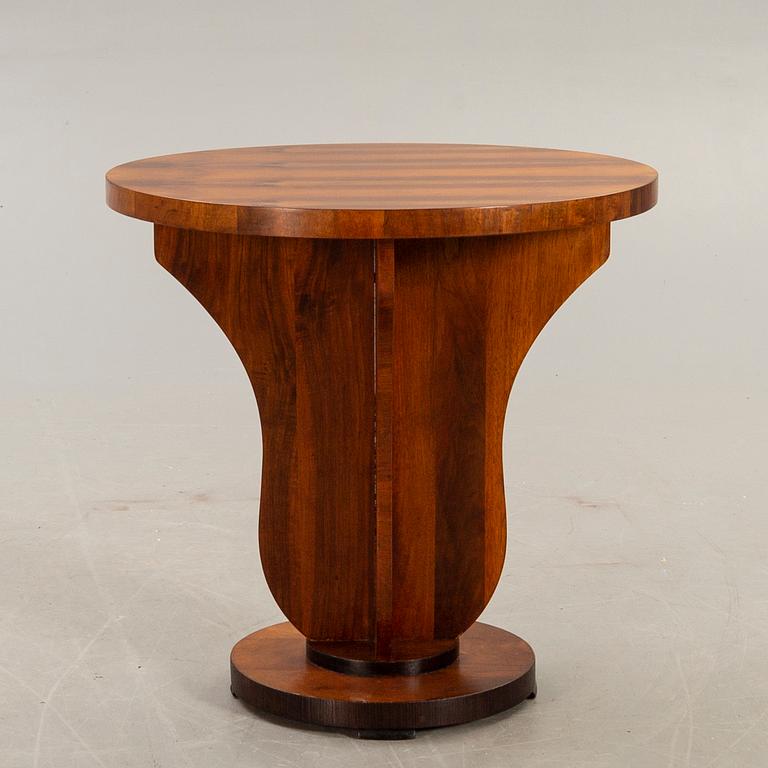 An Art deco style walnut table later part of the 20th century.