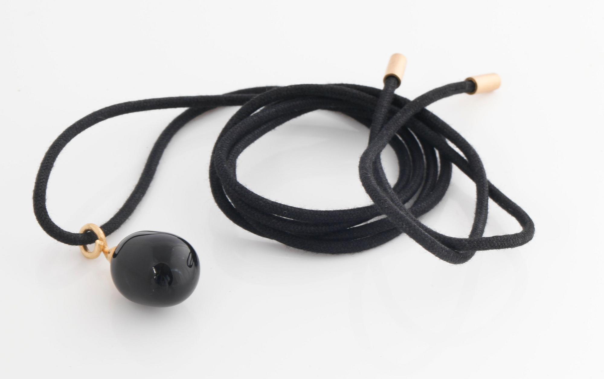 A onyx pendant by Ole Lynggaard.