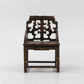 A Chinese lacquered chair, 20th Century.