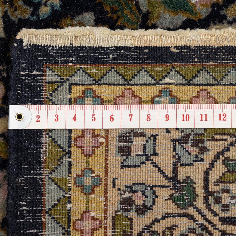 A figural Quum carpet, c. 179 x 125 cm.