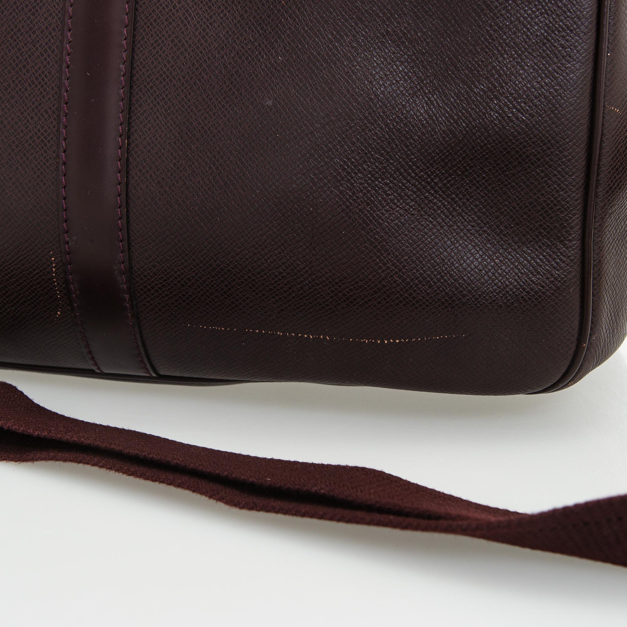 Louis Vuitton, a 'Taiga Kendall PM' weekend bag.