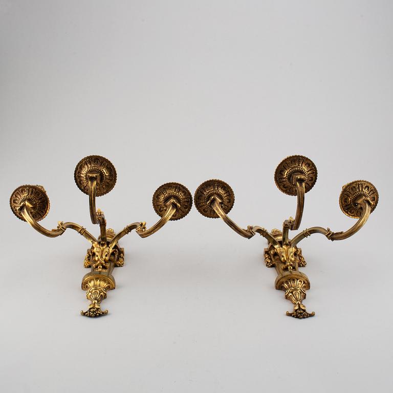 A pair of gilt bronze Louis XVI style wall lights. Late 19th century. 80.