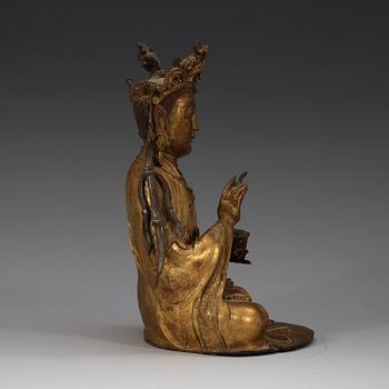 A gilt-bronze figure of a seated Guanyin, Ming dynasty (1368-1644).