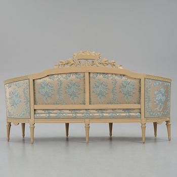 A grey-painted Gustavian 'canapé en corbeille'. sofa, later part of the 18th century.